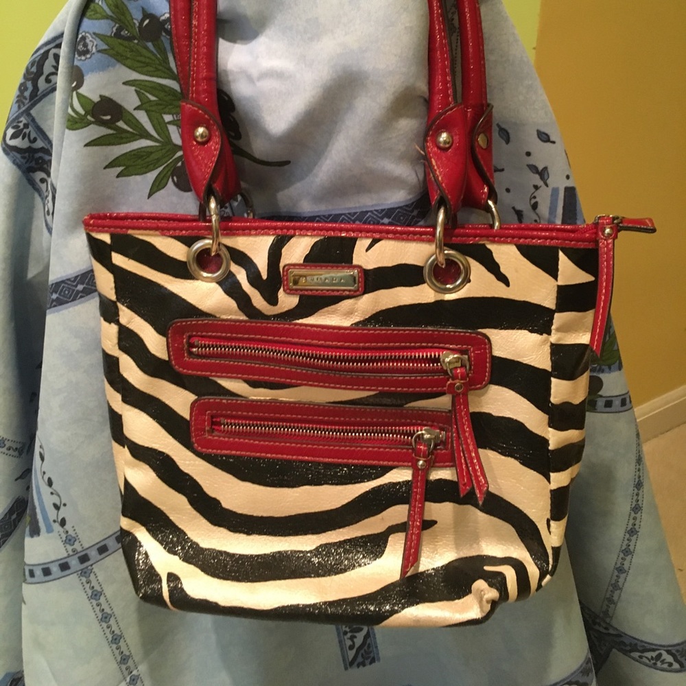 Strands Bag zebra print with dark red accents.